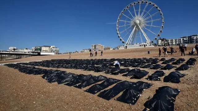 "Body bags" are pictured on Brighton beach in southern England, on April 22, 2015