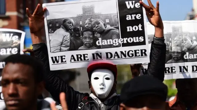 Amnesty International activists and migrants take part in a "funeral march" to outline the Mediterranean migrants crisis around the European Council in Brussels