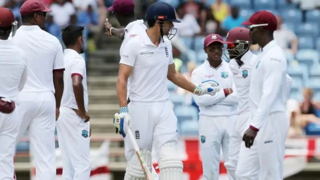 Alastair Cook checks on the welfare of Jermaine Blackwood