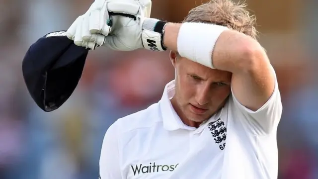 Joe Root leaves the field