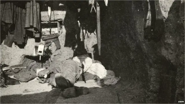 Australian Sergeant Major Dowsett rests in a dug-out