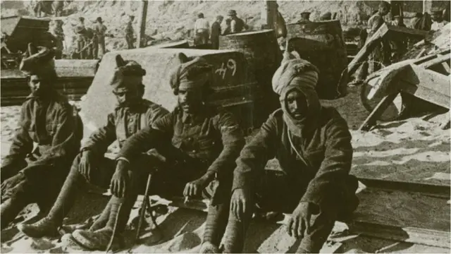 Indian troops on W beach as stores are being unloaded