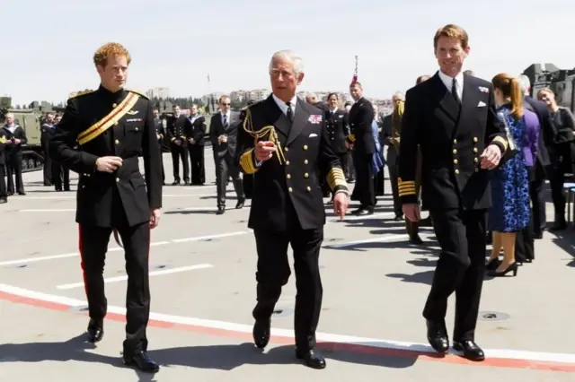 Princes Harry and Charles attend a reception on HMS Bulwark