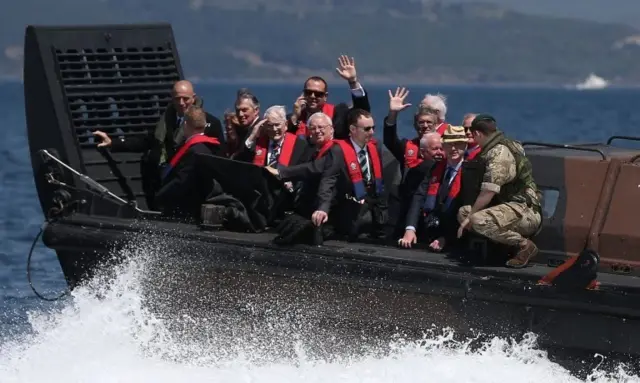 British descendants of Gallipoli troops approach the Turkish shore by landing craft