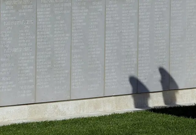 The shadows of Prince Charles and Prince Harry at the Cape Helles memorial