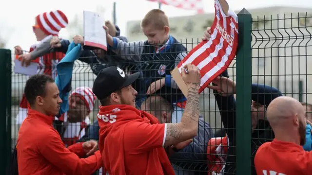 Stoke players sign autographs