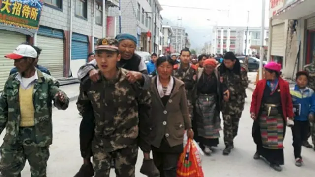 Rescuers help residents of Xigaze Prefecture in Tibet