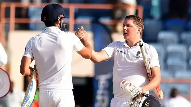 Alastair Cook and team-mate Gary Ballance celebrate