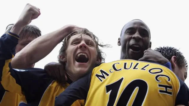 Lee McCulloch of Wigan celebrates scoring with team mates Jimmy Bullard (centre) and Jason Roberts (right) of Wigan in 2006