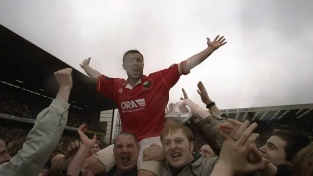 Neil Redfearn is lifted aloft by Barnsley supporters