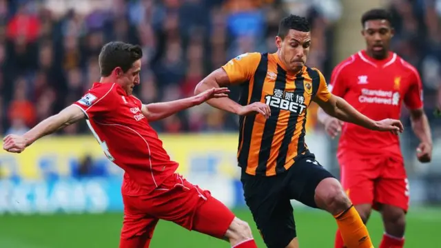 Hull's Jake Livermore takes on the Liverpool defence