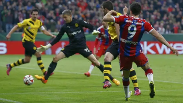 Bayern Munich striker Robert Lewandowski scores