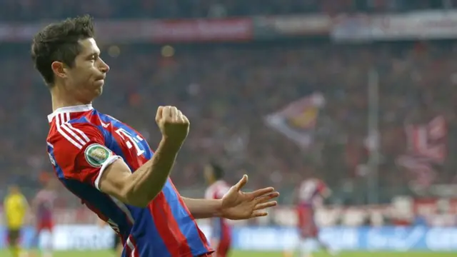 Bayern Munich striker Robert Lewandowski scores