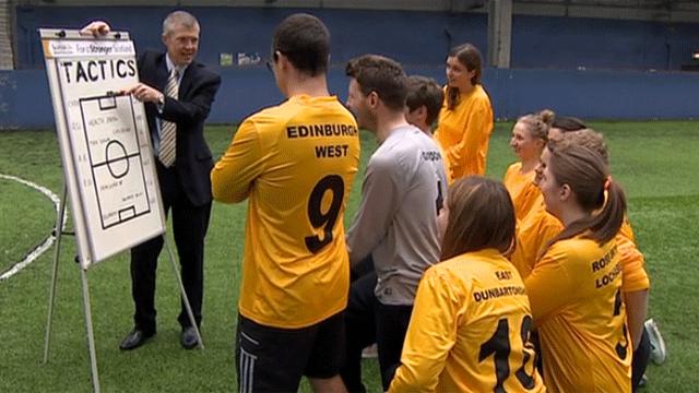 Willie Rennie talked tactics with Lib Dem activists dressed in football kit