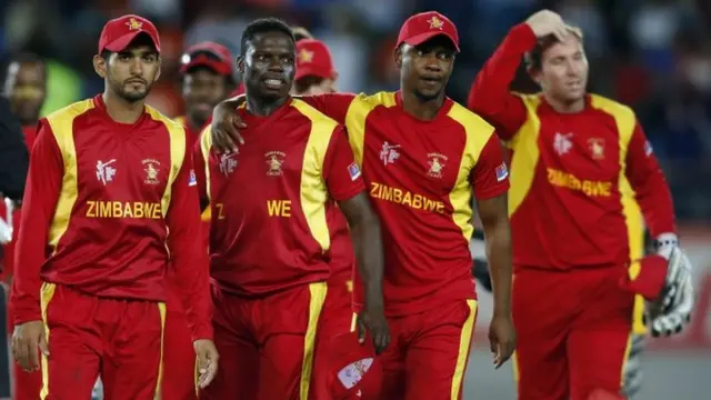 Zimbabwe's cricketers leave the field after losing their Cricket World Cup match against India at Eden Park in Auckland, 14 March 2015