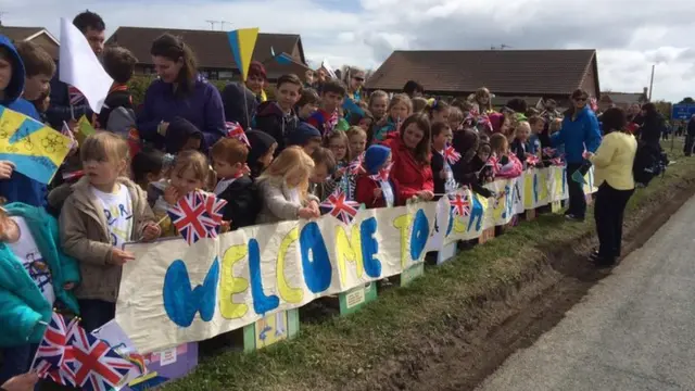 School children lining the route