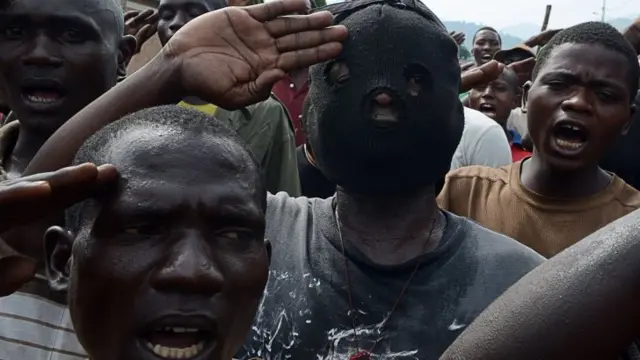 Burundian youths salute as they demonstrate against the president"s bid for a third term on May 1