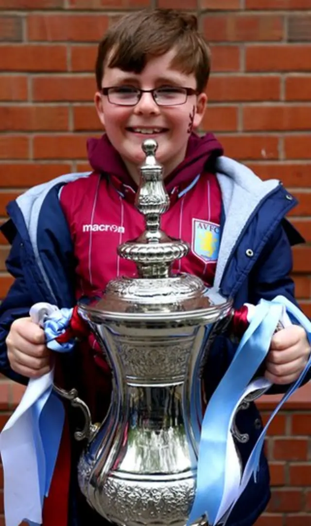 Young Villa fan with the FA Cup