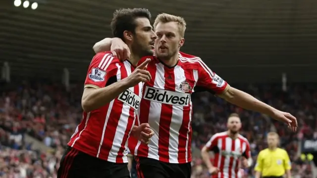 Jordi Gomez celebrates his second penalty