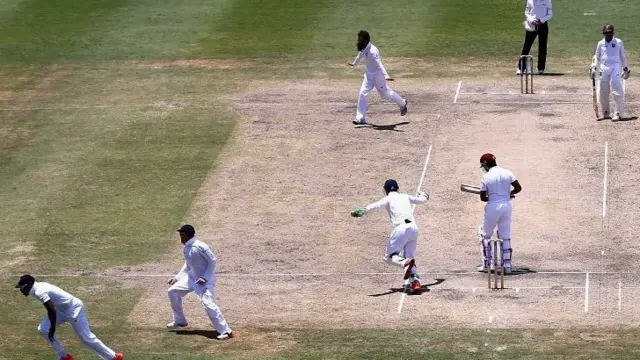 Chris Jordan (L) of England takes the catch