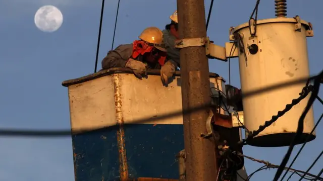 Electricians in the Philippines work on supply lines in anticipation of the Floyd Mayweather-Manny Pacquiao fight