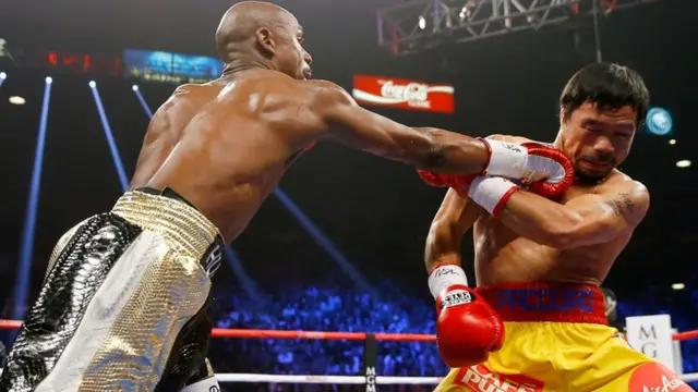 Floyd Mayweather lands a jab on Manny Pacquiao