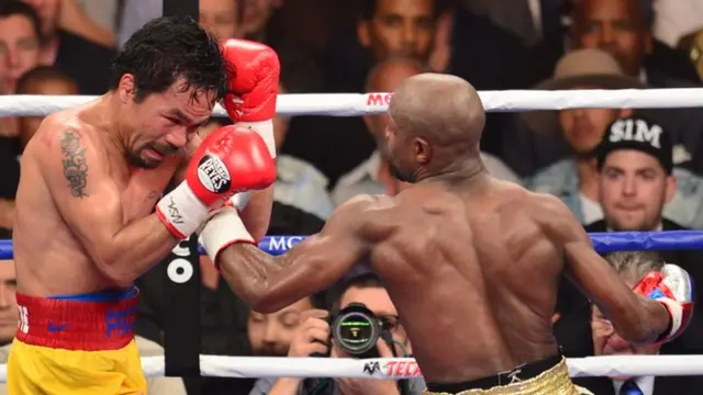 Floyd Mayweather lands a right hook on Manny Pacquiao