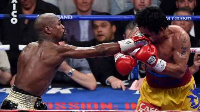 Floyd Mayweather lands a flush right hand on Manny Pacquiao