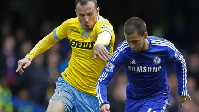 Eden Hazard battles for the ball