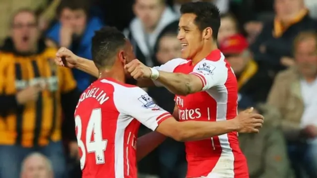 Alexis Sanchez (right) celebrates scoring