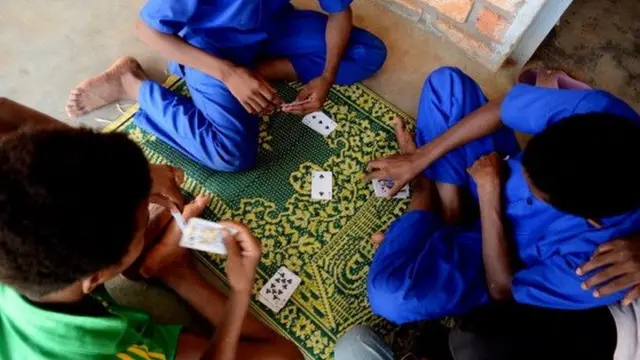 Children play cards at the Italian NGO Coopi reception centre for child soldiers in Bangui in 2013