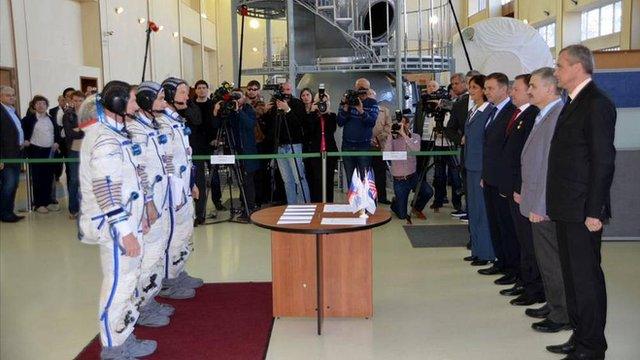 Tim Peake, nearest the camera (L), passes his Soyuz exam