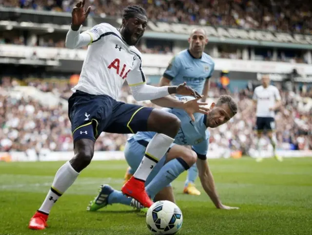 Tottenham's Emmanuel Adebayor in action with Manchester City"s Martin Demichelis