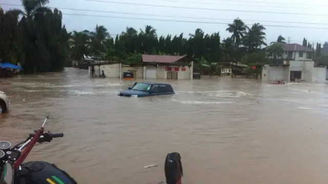 Car driving through flood in Dar es Salaam