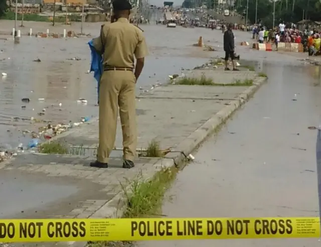 Policeman at a main road