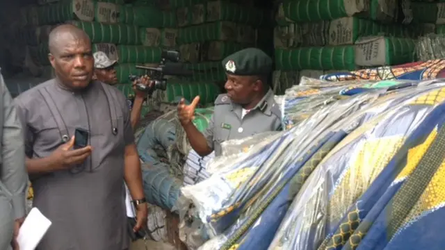 Officials looking at confiscated material in Kano, Nigeria