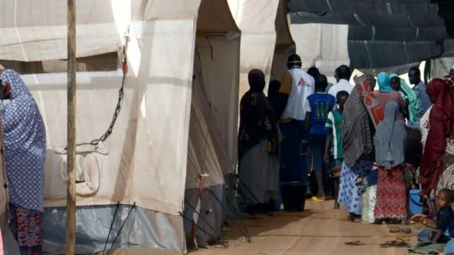 People gather at the health center of Lazaret, near Niamey, on April 23, 2015, where are treated patients suffering from meningitis.