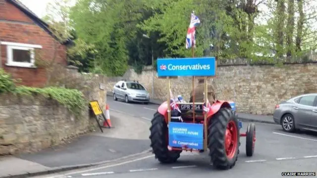 Tractor bearing Conservatives banners