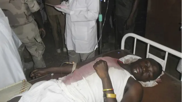 A student wounded during a suicide bomb attack at the College of Administrative and Business Studies receives treatment at a hospital in Potiskum Nigeria Friday, 8 May 2015