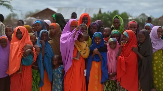 Refugees gather to watch the arrival of United Nations High Commissioner for Refugees Antonio Guterres at IFO-2 complex of the sprawling Dadaab refugee camp on May 8, 2015.