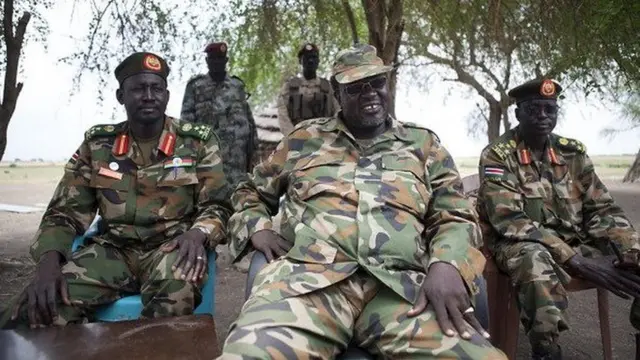 South Sudanese rebel leader and former vice president Riek Machar (C) sits in an army barracks in South Sudan's Upper Nile State on 14 April 2014