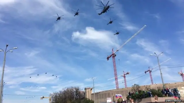 Helicopters fly over the Victory Day Parade