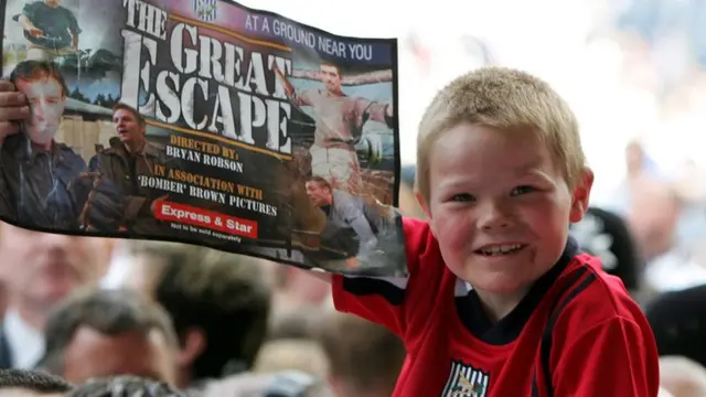 A child celebrates West Brom surviving in 2005