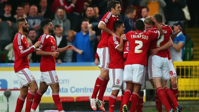 Swindon celebrate progressing in the play-off