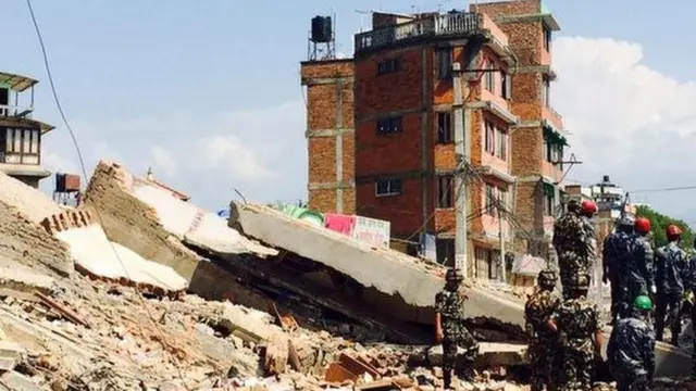 Four-storey building collapses