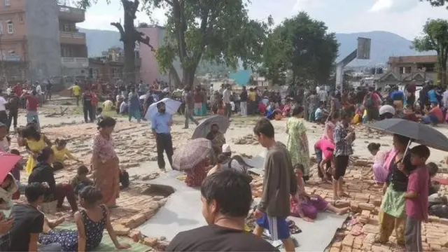 People trying to build makeshift shelters