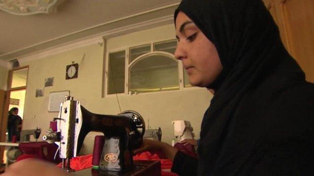 Woman with sewing machine