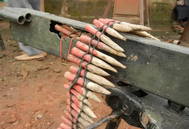 Replica machine-gun and wooden bullets