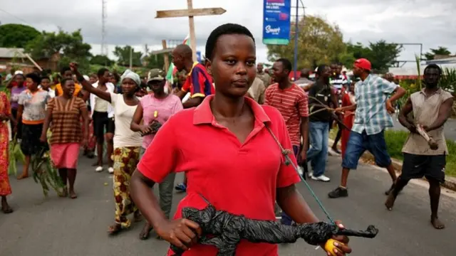 Demonstrators take part in a protest in Bujumbura on 13 May 2015