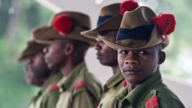 Tanzanian police wait for delegates to arrive at the State House in Dar es Salaam on 13 May 2015